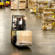 Forklift trucks in a warehouse